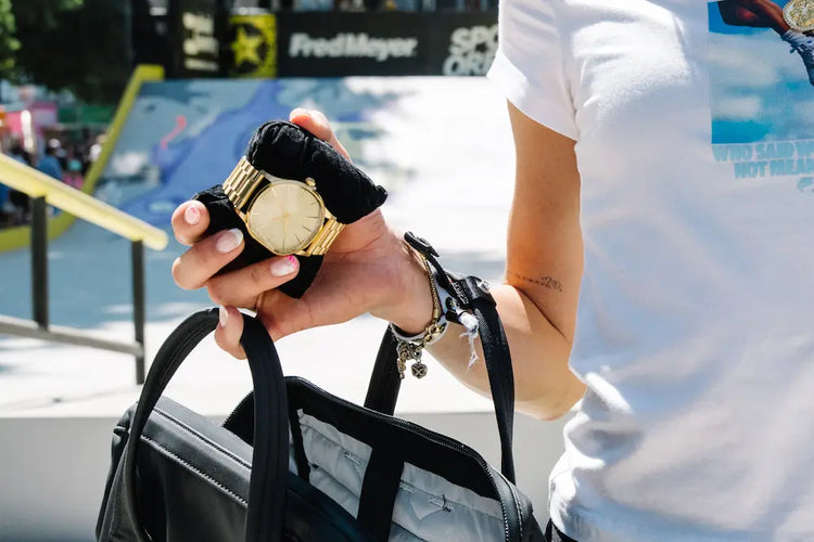 Close up of a female skateboarding holding her custom Nixon analog trophy watch at the 2026 Rockstar Energy Open
